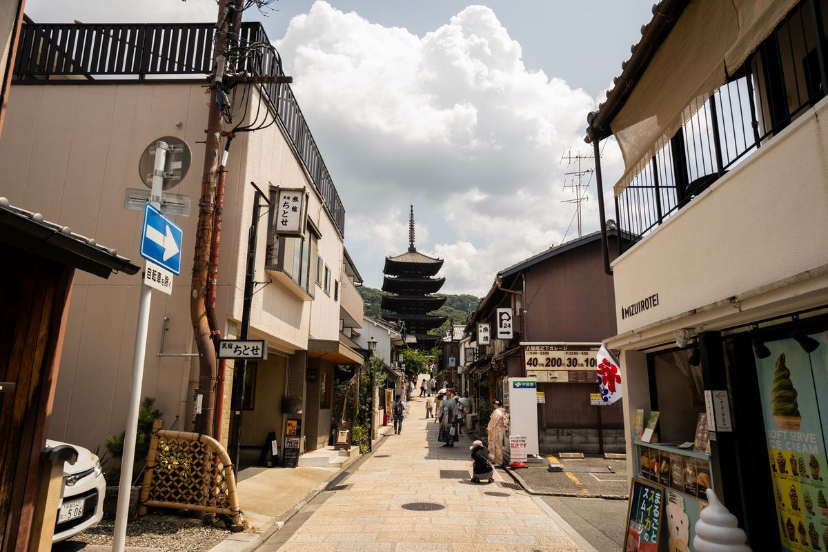 Yasaka Pagoda rising above a traditional wooden street in Higashiyama, Kyoto, Japan